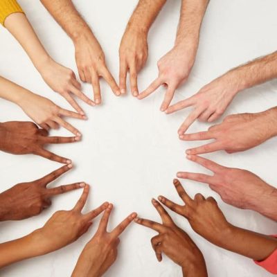 diversity, race, ethnicity, international and people concept - group of hands showing peace hand sign